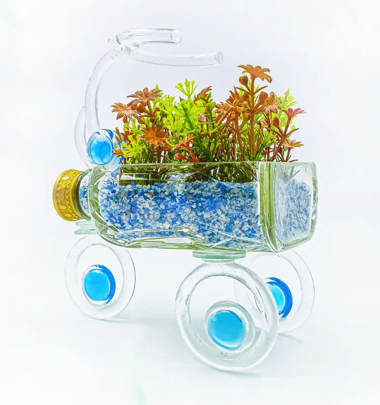 Artistic blue and gold tricycle glass planter upcycled from waste bottles