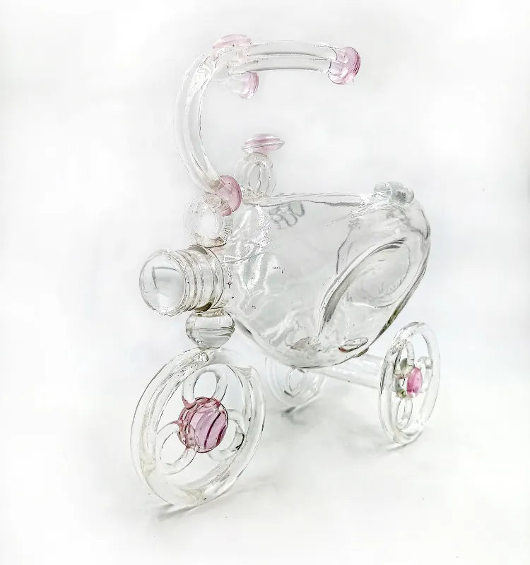 Decorative indoor planter crafted as a tricycle from recycled glass, featuring vibrant faux flora display"