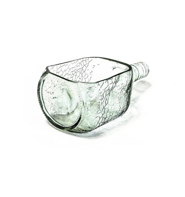 Designer tabletop glass planter made from Old Monk bottle with drainage hole