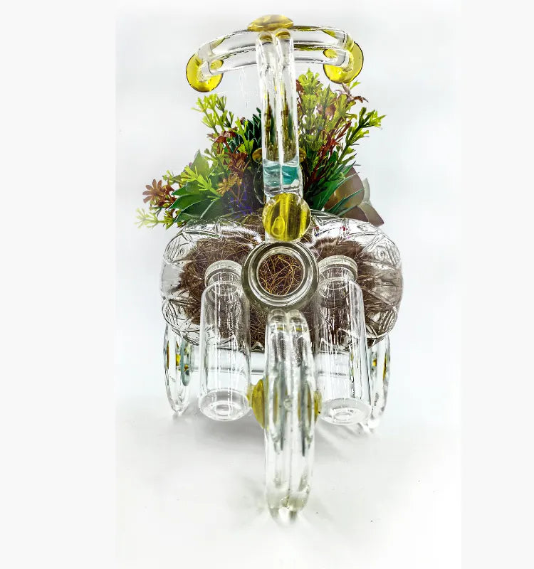 Detailed shot of handmade glass tricycle planter for plants