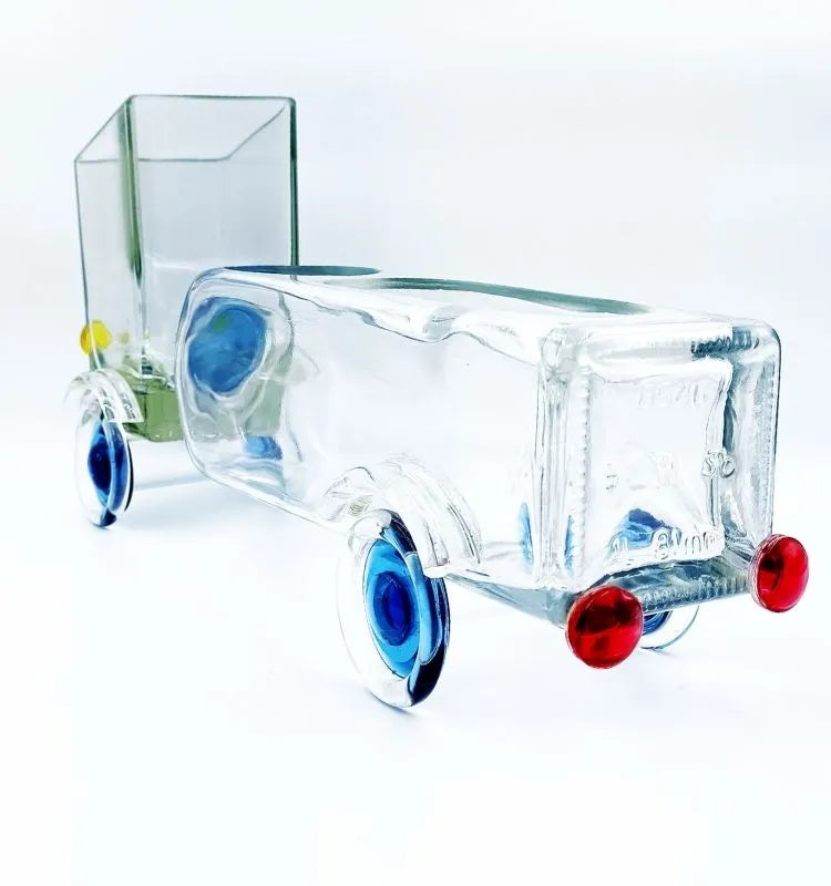 Upcycled Golden Bloom Truck Planter by Krystal Kraft, crafted from a repurposed Johnnie Walker Gold Label bottle with dual functionality as a planter and candle holder, ideal for sustainable home decoration.