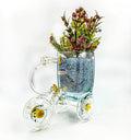 Eco-conscious Tezon Tricycle Planter crafted from recycled glass bottles – artisan home decoration