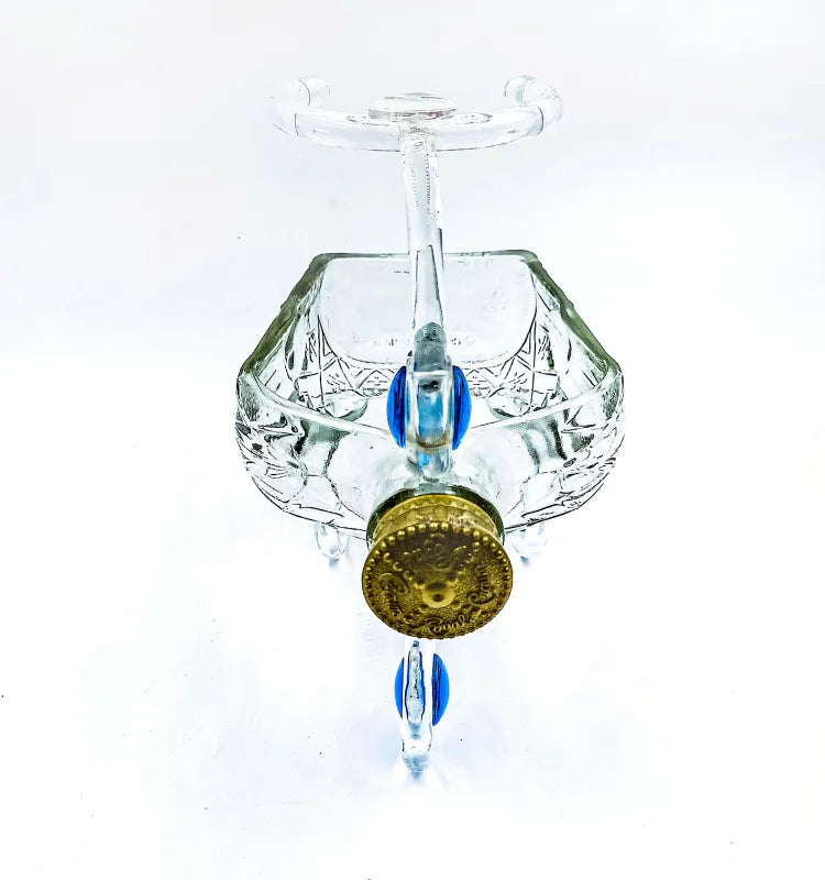 Eco-conscious glass planter centerpiece with blue decorative sand