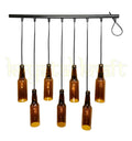Eco-friendly upcycled beer bottle pendant lamp handmade by Krystal Kraft for sustainable home décor.