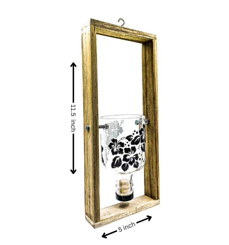 Eco-friendly handcrafted hanging planter made from upcycled Greater Than Gin bottle with floral print by Krystal Kraft India – sustainable wall décor for home and garden.