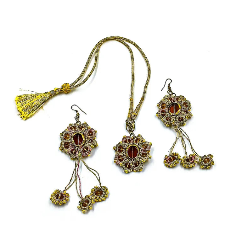 Close-up of the Golden Bloom Tatting Lace Jewelry Set featuring handmade champagne gold chandelier earrings and a matching statement necklace, crafted by artist Shaista Merchant.