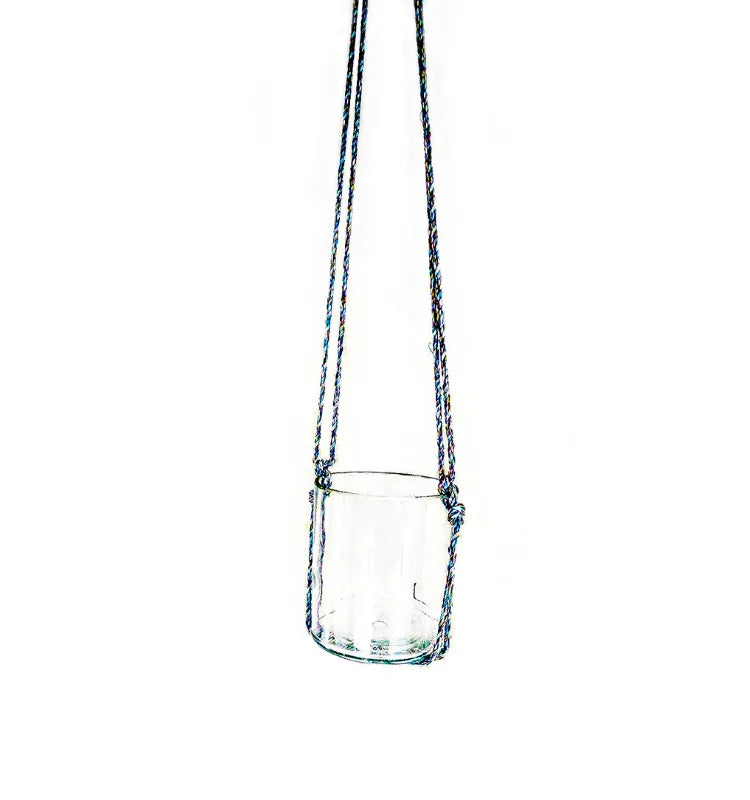 Artisan Krystal Kraft glass bottle planter hand-knotted for stylish hanging display, ideal for kitchen or dining room greenery.