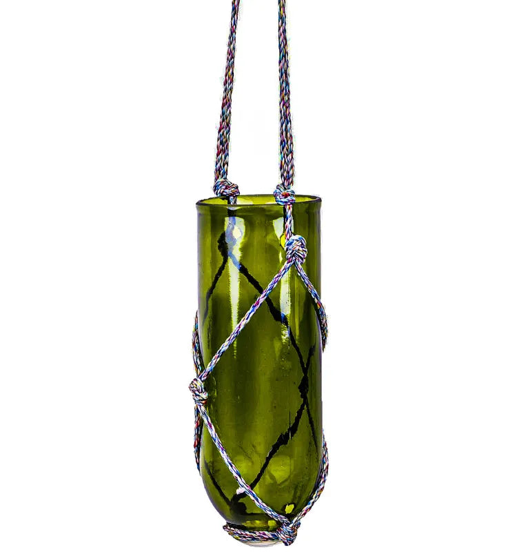Modern eco-conscious balcony planter, KRYSTAL KRAFT upcycled bottle planter in green glass for indoor and outdoor use