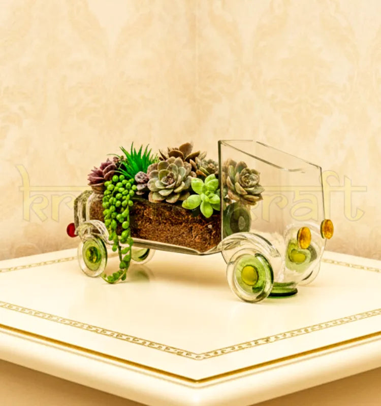 Handcrafted Nostalgic Gold Rush Truck Planter by Krystal Kraft, designed by Raees Ahmed Merchant from an upcycled Gold Label whiskey glass bottle – vintage-inspired glass art piece perfect as a planter, candle holder, or centerpiece.