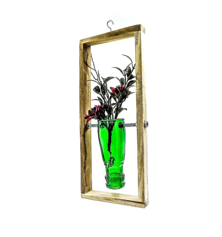 Recycled glass bottle transformed into a stylish hanging planter frame by Indian artisans at Krystal Kraft.
