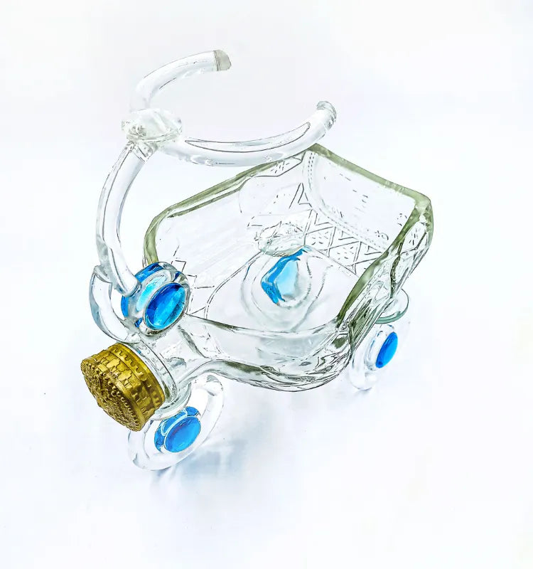 Recycled glass planter in tricycle design featuring home décor greenery