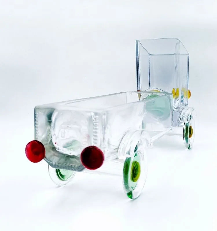 Beautifully crafted upcycled Gold Label Glass Truck by Krystal Kraft, showcasing intricate detailing and vibrant colors – ideal as a sustainable home décor piece, snack server, or elegant flower display.