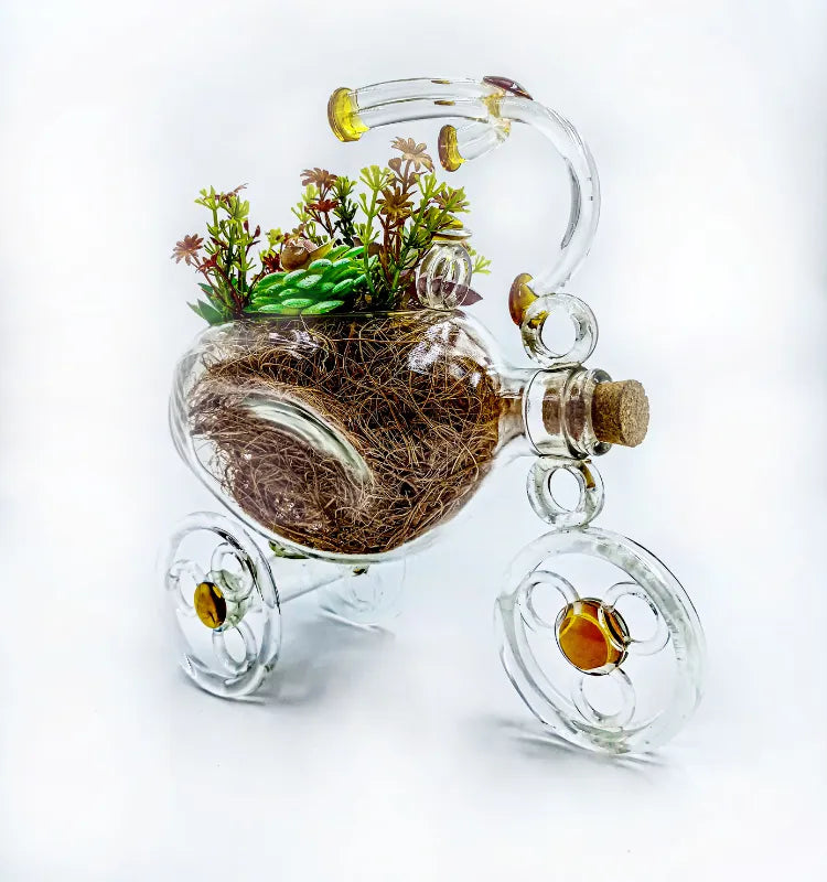 Sustainable upcycled glass sculpture planter in tricycle design