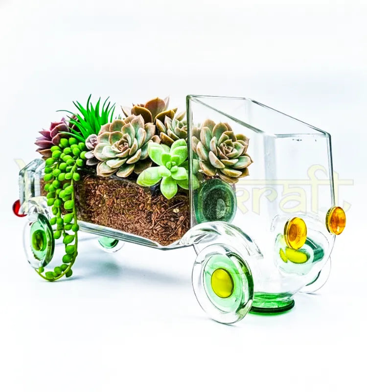 Handcrafted Nostalgic Gold Rush Truck Planter by Krystal Kraft, designed by Raees Ahmed Merchant from an upcycled Gold Label whiskey glass bottle – vintage-inspired glass art piece perfect as a planter, candle holder, or centerpiece.