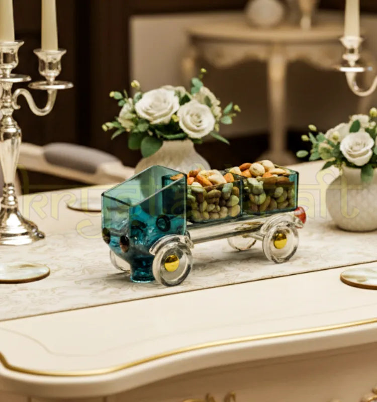 Upcycled black glass Tempo model by Raees Ahmed Merchant – artistic Krystal Kraft creation featuring translucent glass, yellow detailing, and amber headlights, a perfect blend of sustainability and sophisticated décor."