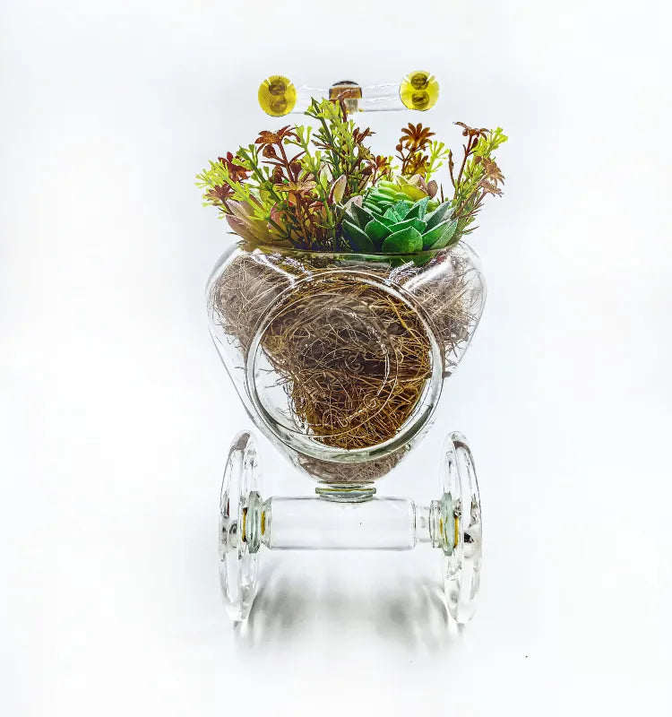 Upcycled glass bottle tricycle-shaped planter with lemon yellow accents