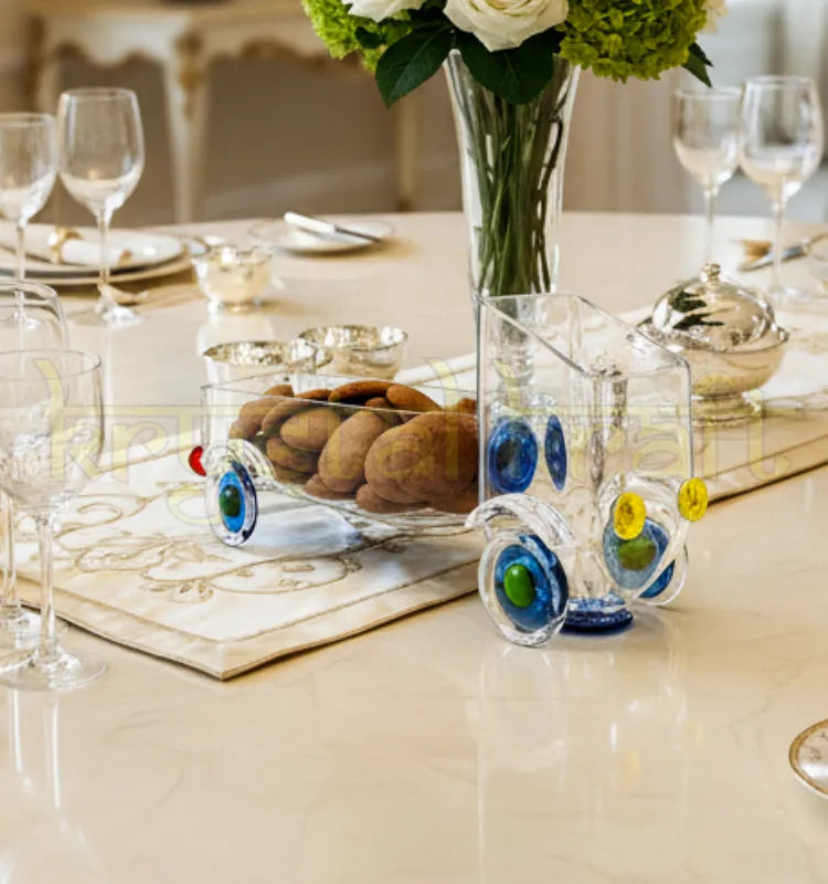 Handcrafted Zoom Zoom Truck Snack Server by Krystal Kraft, designed by Raees Ahmed Merchant from an upcycled gold label whisky bottle – transparent glass truck for serving snacks, flowers, or candles in eco-friendly style.