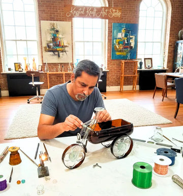 “Sustainable Indian artist Raees Ahmed Merchant creating upcycled bottle art for Krystal Kraft, eco-friendly handmade décor crafted from recycled glass bottle.”