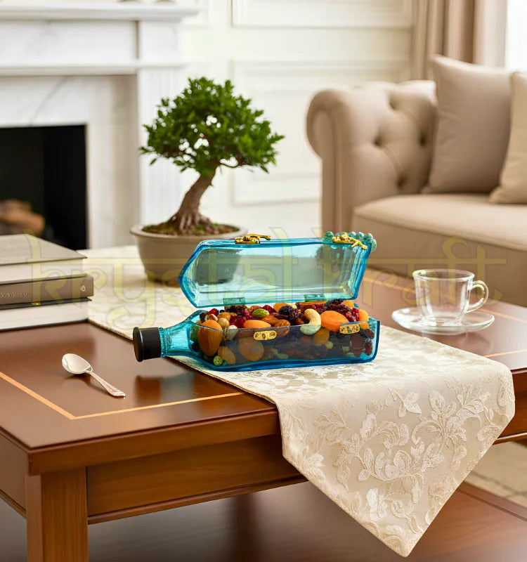 "Upcycled Bombay Sapphire glass canister by Krystal Kraft filled with dry fruits on kitchen counter"