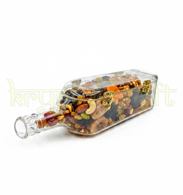 Upcycled Johnnie Walker glass bottle canister on modern kitchen countertop storing cashews almonds dry fruits next to coffee maker elegant home decor storage solution handcrafted by Krystal Kraft artist