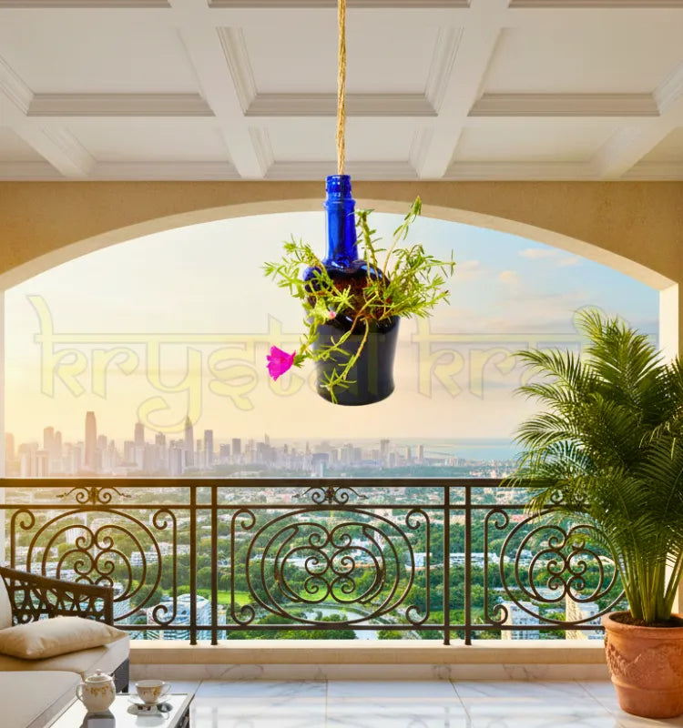 Eco-friendly upcycled blue glass hanging bottle planter for indoor or outdoor décor.