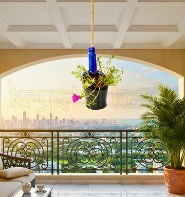 Eco-friendly upcycled blue glass hanging bottle planter for indoor or outdoor décor.