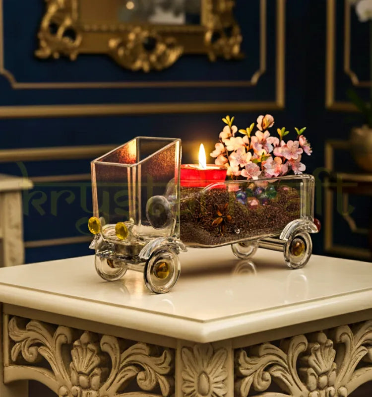 Handcrafted Aristocrat’s Truck Planter by Krystal Kraft, designed by Raees Ahmed Merchant from an upcycled Gold Label whisky bottle – eco-friendly glass art serving as both planter and candle holder for stylish home décor.