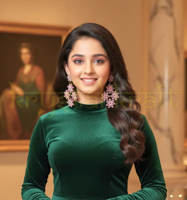 Handcrafted jhumka-inspired paper quilling earrings displayed on jewelry stand, highlighting eco-friendly materials and intricate floral design.