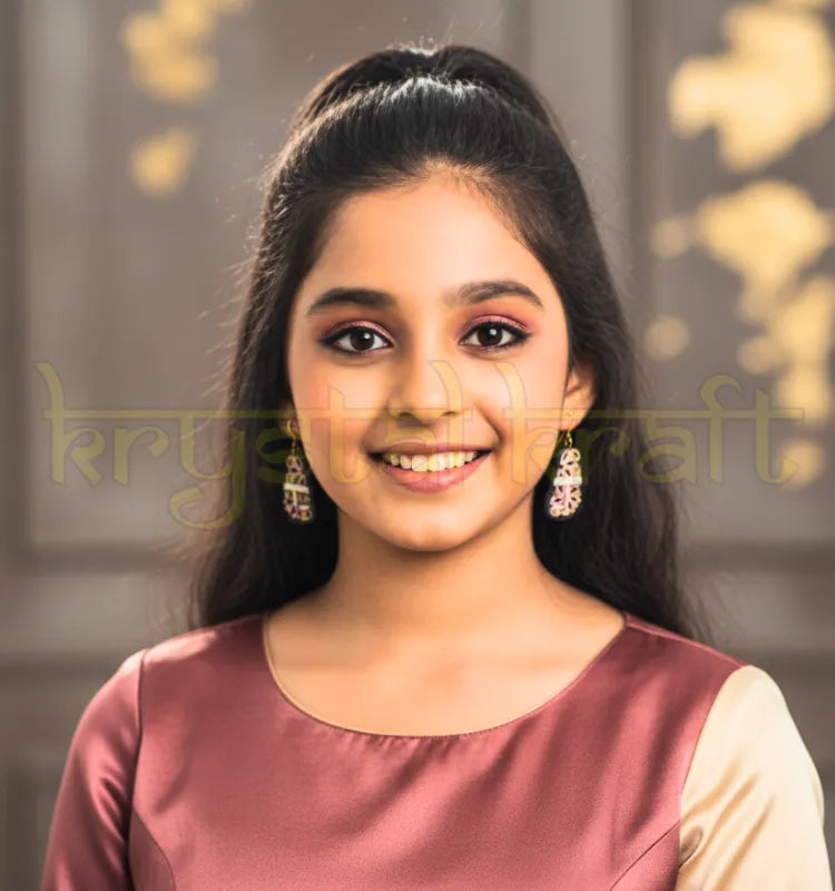 Close-up of handmade purple and white Kolhapuri-style paper quilling earrings by Krystal Kraft on a neutral background, showing intricate coils and lightweight ear wires.