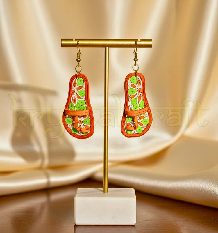 “Front view of Artistic Vibrant Kolhapuri paper quilling earrings by Krystal Kraft in orange, green, and white, handmade by artist Farisa Merchant.”