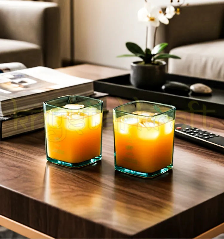 Elegant pair of blue upcycled Bombay Sapphire glasses crafted from recycled bottles.