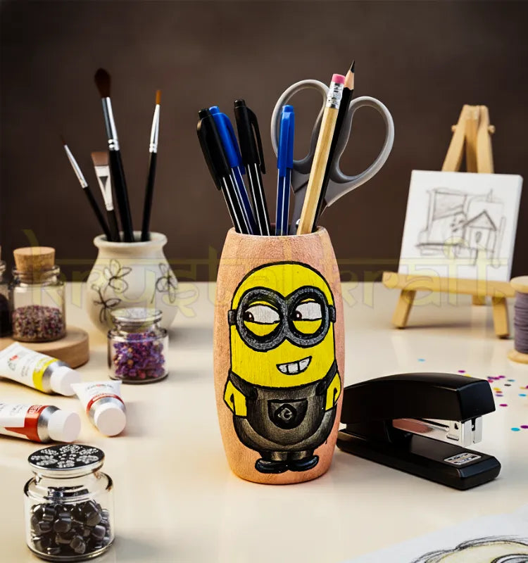 Hand-painted Buoyant Minion design on a recycled Amul mini glass bottle featuring yellow, grey, and pink acrylic colors — an eco-friendly mini vase or pen stand by Krystal Kraft.