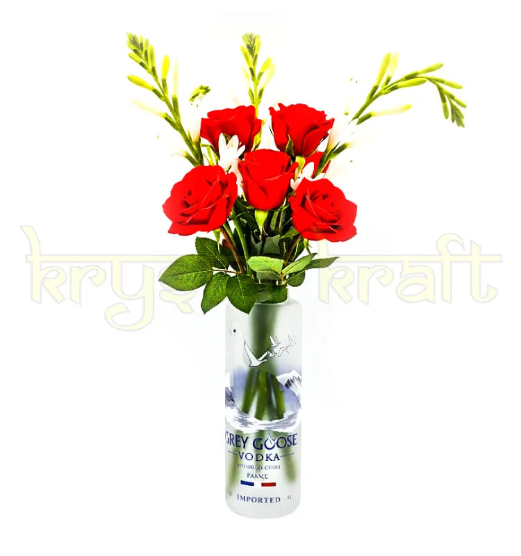 Handmade bottle vase crafted from a recycled Grey Goose bottle for living room styling.