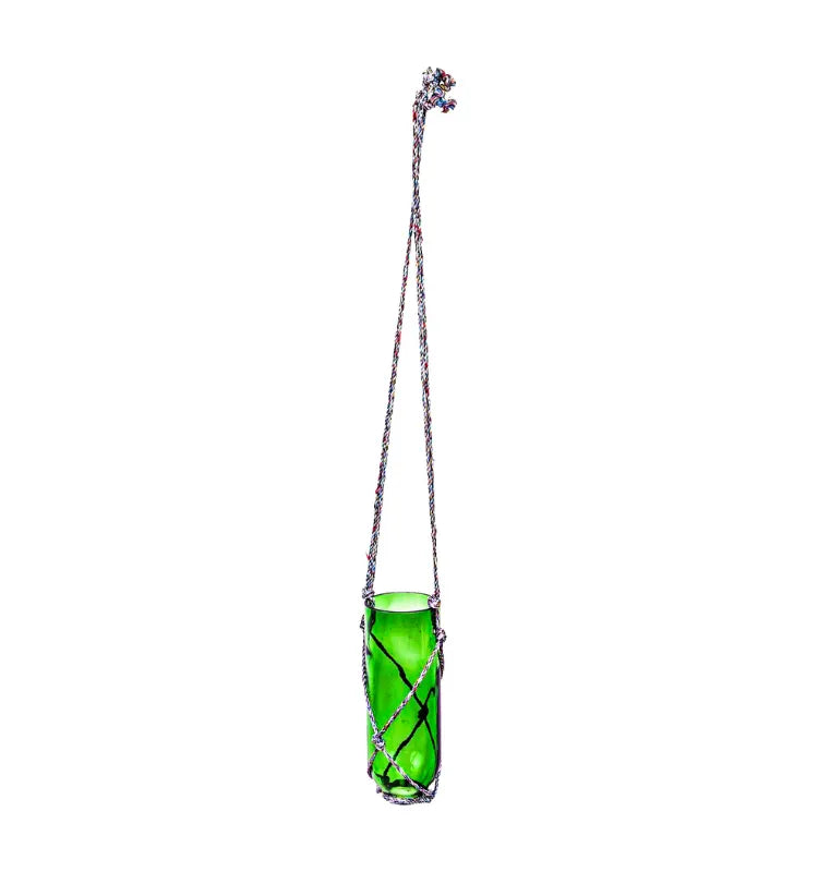 Designer glass bottle planter with hand-knotted holder, sustainable and perfect as a gifting option.