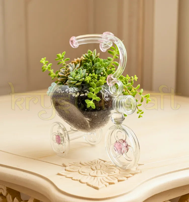 Dimple Tricycle Planter handcrafted by artist Raees Ahmed Merchant from upcycled glass bottles — featuring clear glass with pink and blue highlights in a vintage tricycle design, perfect for eco-friendly home décor or gifting.