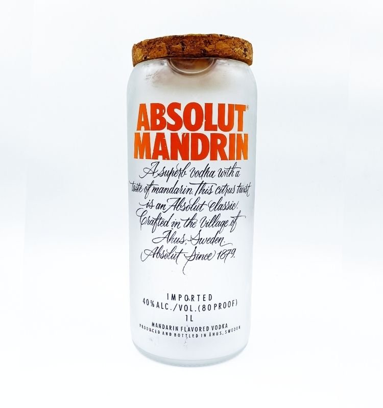 Elegant handcrafted Absolut Mandrin upcycled glass jar with vibrant orange label and smooth finish, perfect as an eco-friendly gift or decorative accent.