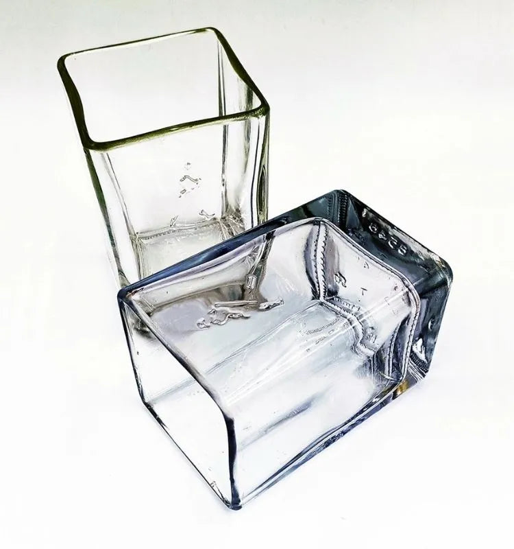 Pair of eco tumblers made from upcycled Johnnie Walker bottles, perfect for sustainable living.
