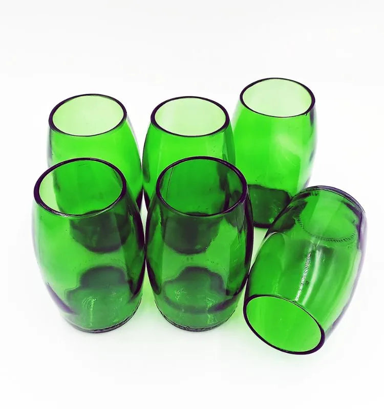 Upcycled drinking glass with iconic green Perrier color and branded design, handcrafted for eco-conscious home décor lovers.