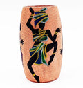 Upcycled pink glass bottle hand-painted with an African Lady motif in vivid acrylics — lightweight, durable, and perfect as a decorative vase or sustainable art gift.