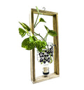 Artisan-made sustainable hanging planter crafted from recycled gin bottle with floral artwork – perfect eco-friendly décor by Krystal Kraft.
