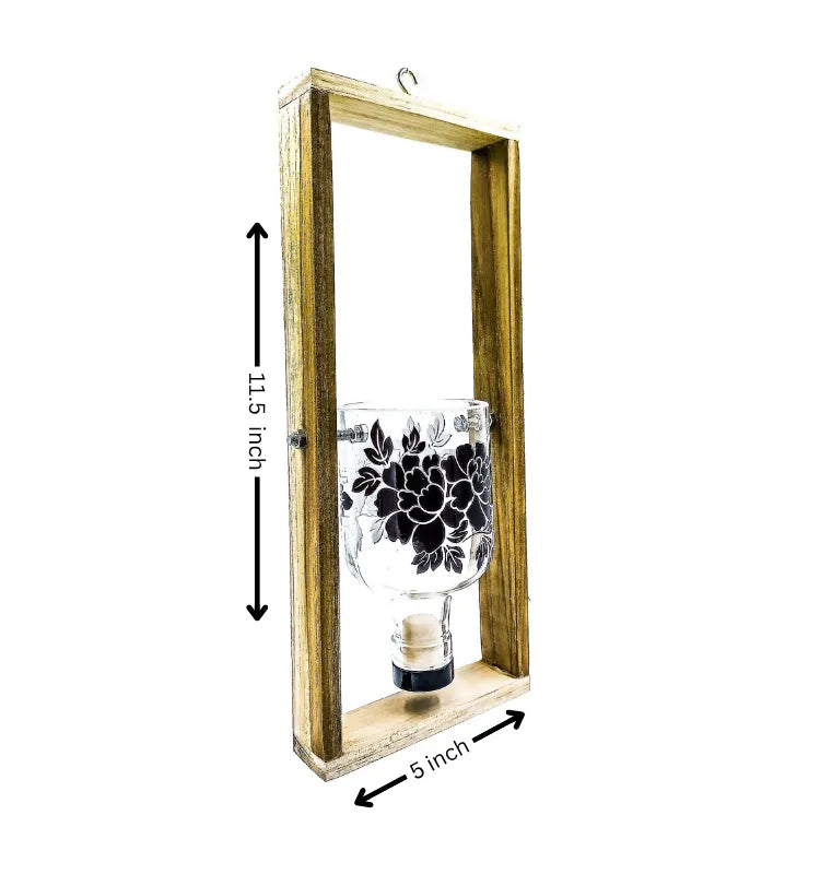 A one-of-a-kind eco-chic hanging planter created from a repurposed Greater Than Gin bottle, detailed with floral artwork and mounted on a frame — blending sustainability with modern style.