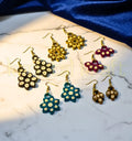 “Handmade sustainable paper quilling earrings set of 5 by Krystal Kraft crafted by artist Farisa Merchant.”