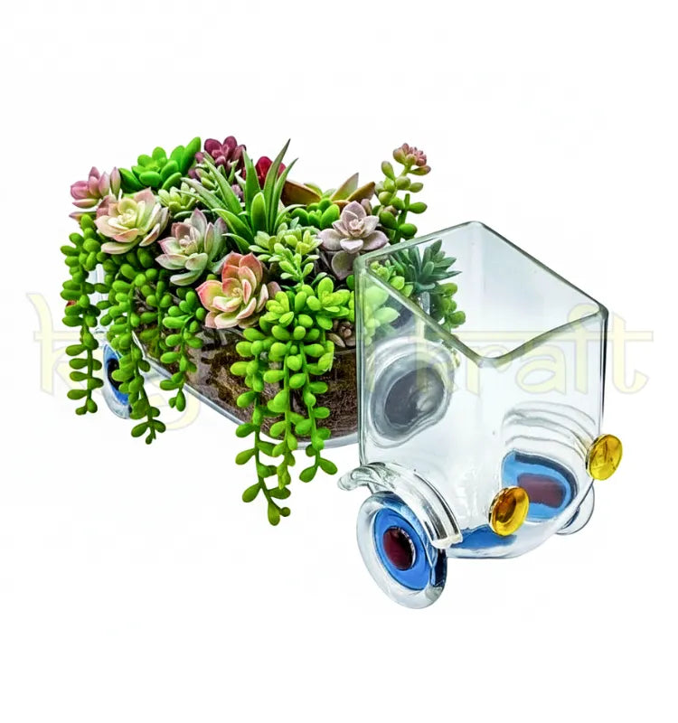 Handcrafted Speed Green Planter by Krystal Kraft, designed by Raees Ahmed Merchant from an upcycled Johnnie Walker Gold Label bottle – transparent glass truck-shaped planter perfect for succulents, herbs, and eco-friendly home décor