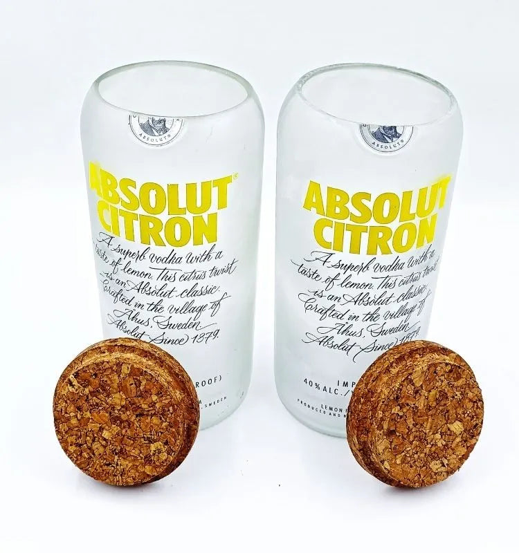 Pair of upcycled Absolut Citron jars made from authentic bottles, showcasing polished glass finish and bold branding for stylish, sustainable interiors.