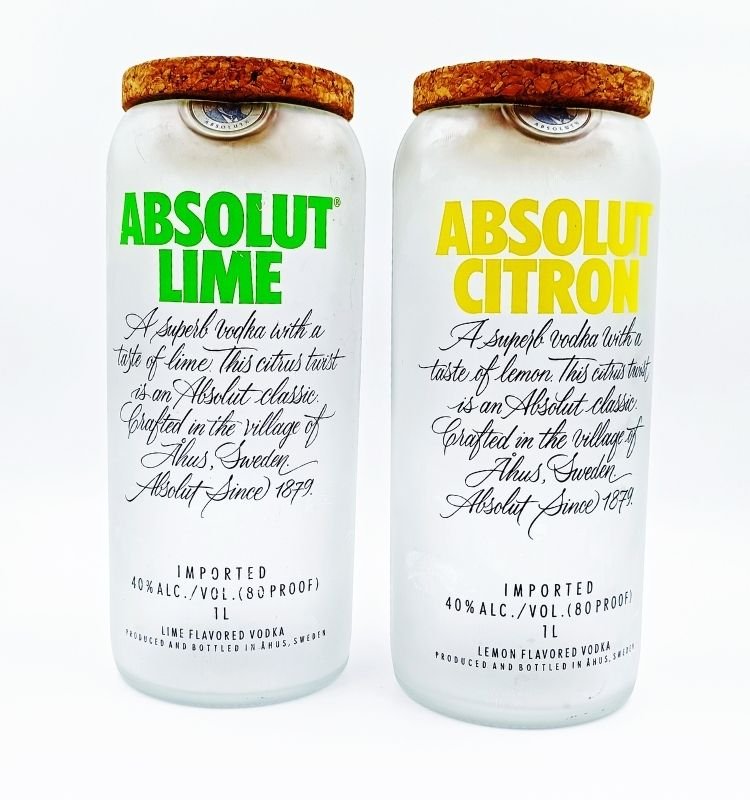 Pair of handcrafted upcycled Absolut Lime and Citron glass jars made from original bottles, perfect for eco-luxury home decor or sustainable gifting.