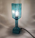 Upcycled bottle lamp illuminating cozy home corners