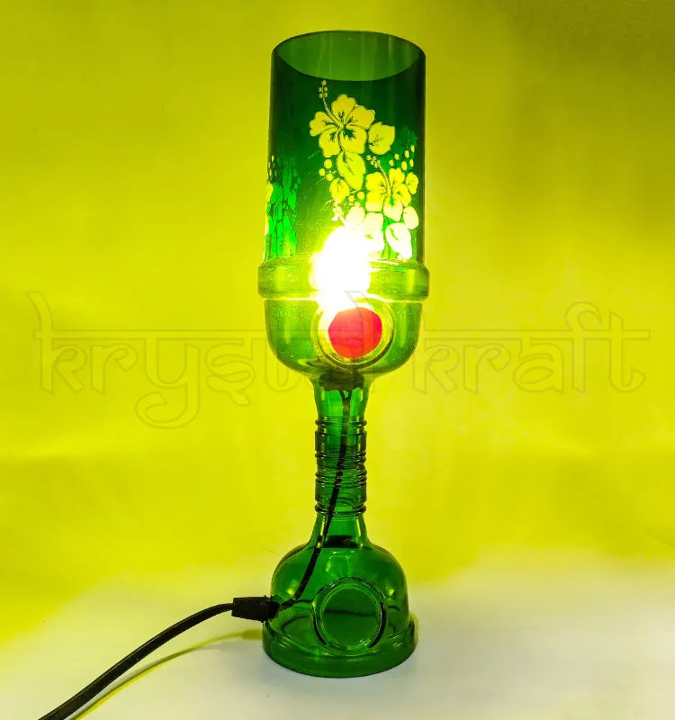 Green Tanqueray bottle lamp glowing as ambient home décor lighting"