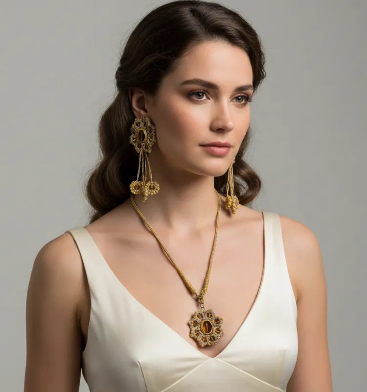 Close-up of the Golden Bloom Tatting Lace Jewelry Set featuring handmade champagne gold chandelier earrings and a matching statement necklace, crafted by artist Shaista Merchant.