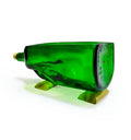 Handcrafted green glass bottle planter placed on a living room shelf as home décor