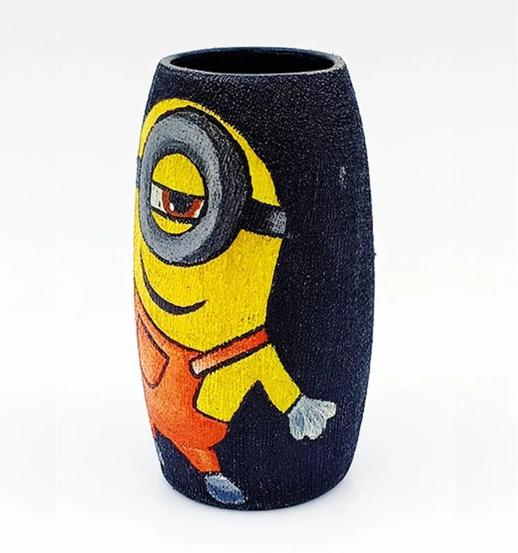 Hand-painted Cool Minion artwork on a black recycled glass bottle — a small, durable, and artistic décor accent for home or office spaces.